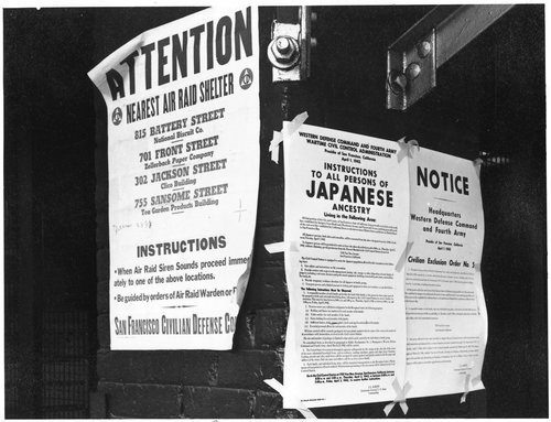 San Francisco, California. On a brick wall beside air raid shelter poster, exclusion orders were po . . .
