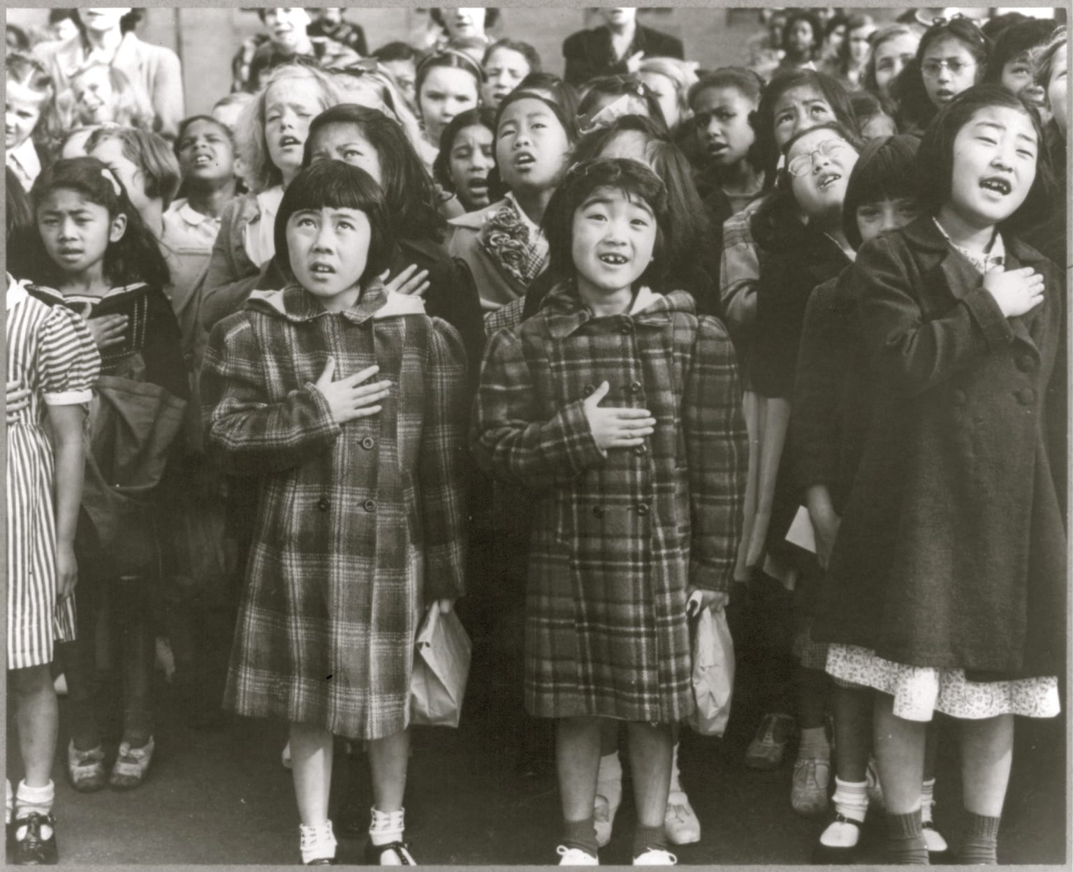 Japanese-American children at concentration camp pledging to the USA's flag